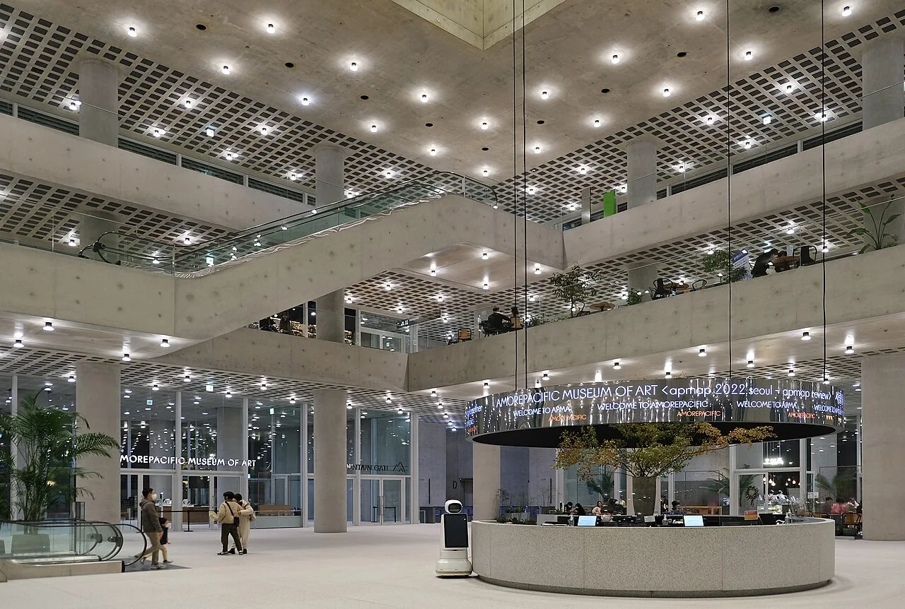 Atrium inside Amorepacific headquarters in Yongsan, photographed in November 2022; not the renewed 2026 store interior.